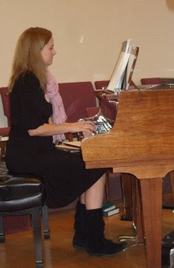 Sara Greenleaf plays piano during service